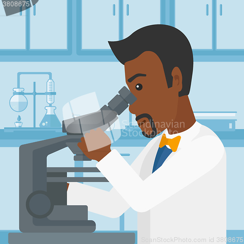 Image of Laboratory assistant with microscope.
