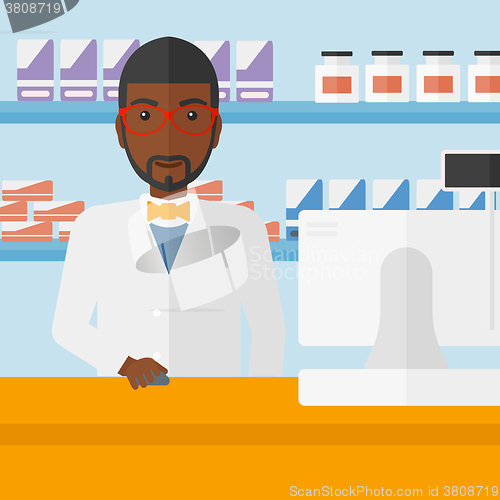 Image of Pharmacist at counter with cash box.