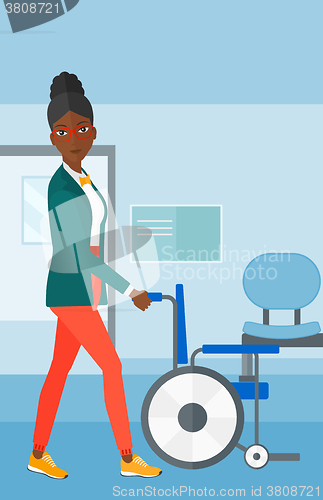 Image of Woman pushing wheelchair.