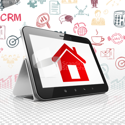 Image of Business concept: Tablet Computer with Home on display