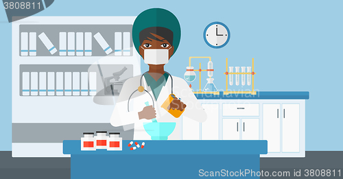 Image of Pharmacist preparing medicine.