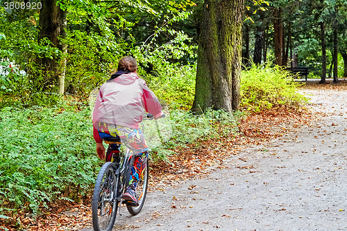 Image of Woman on the bicycle in the park