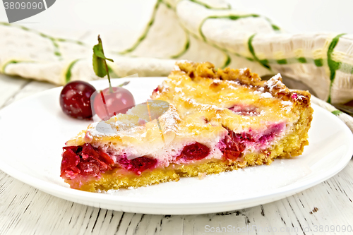 Image of Pie cherry with sour cream in plate on light board