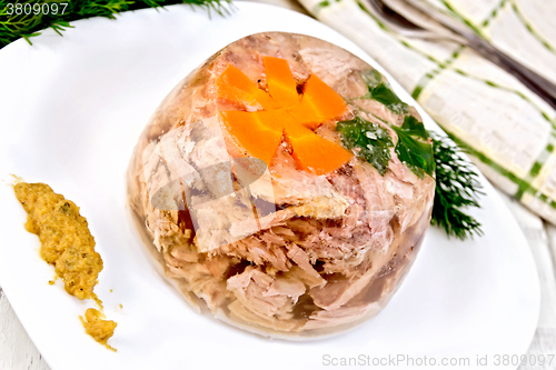 Image of Jellied in plate with mustard and dill on light board