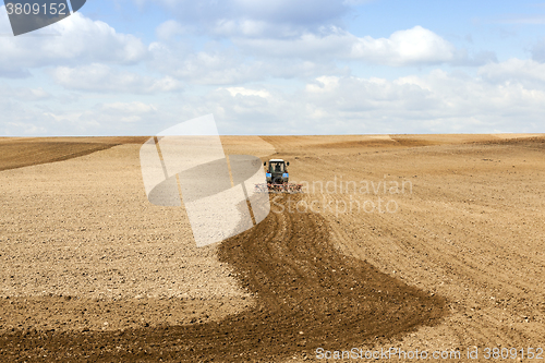 Image of tractor plowing field 
