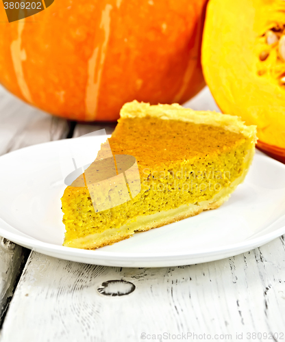 Image of Pie pumpkin in plate on board