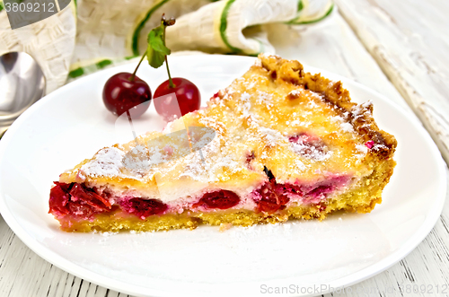 Image of Pie cherry with sour cream in plate on board