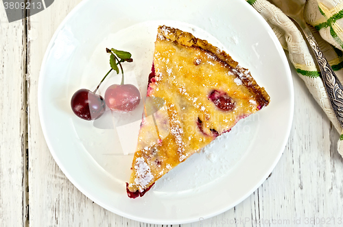 Image of Pie cherry with sour cream in plate on board top