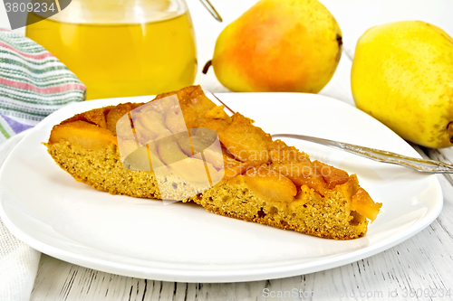 Image of Pie with pears and honey in plate on board