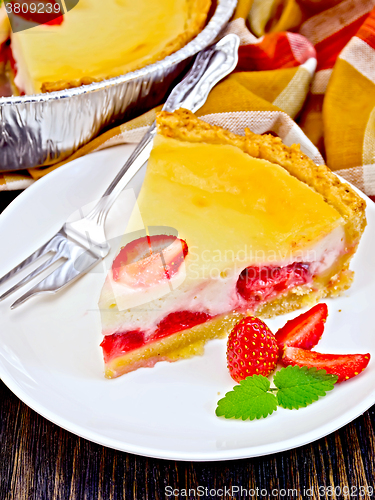 Image of Pie strawberry with sour cream on dark board