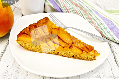 Image of Pie with pears and honey in plate on light board