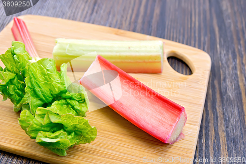 Image of Rhubarb with leaf on dark board