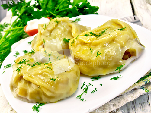 Image of Manty with dill in dish on light board