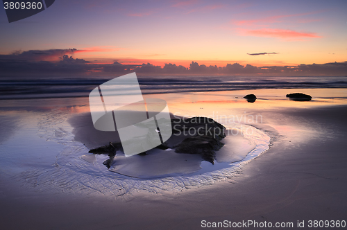 Image of Sunrise reflections on the beach