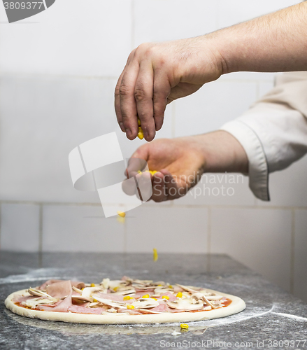 Image of Making the Pizza - Hands Detail 