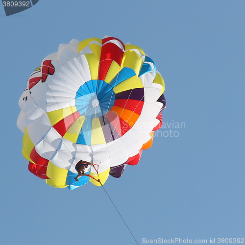 Image of Parasailing in a blue sky