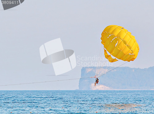 Image of Parasailing in a blue sky