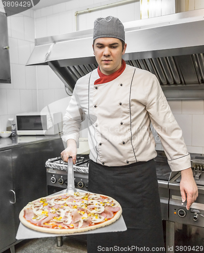Image of Chef Cooking Pizza
