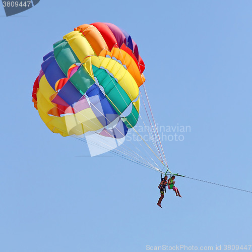 Image of Parasailing in a blue sky