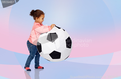 Image of happy mulatto little baby girl playing with ball