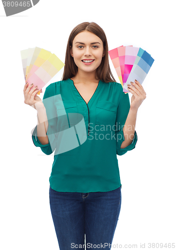 Image of smiling young woman with color swatches