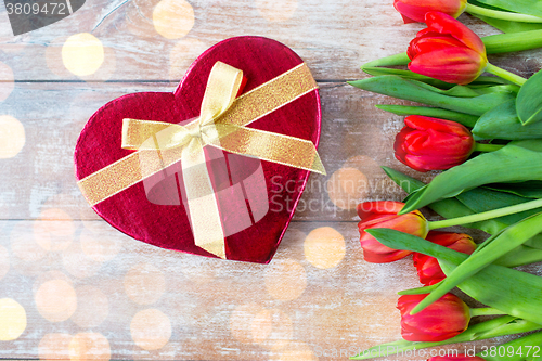 Image of close up of red tulips and chocolate box