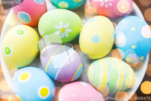 Image of close up of colored easter eggs on plate