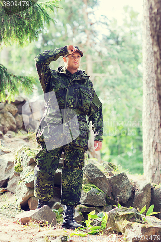 Image of young soldier or ranger in forest