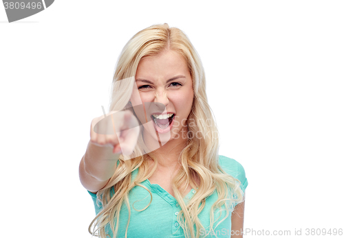 Image of happy young woman pointing finger to you