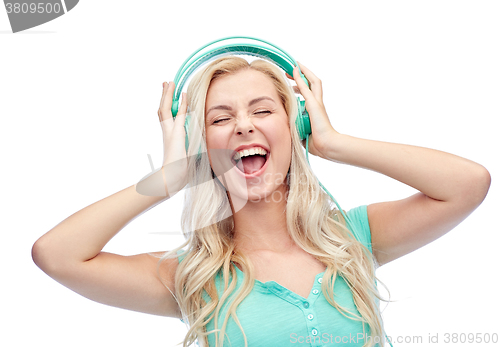 Image of happy young woman or teenage girl with headphones