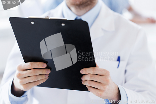 Image of close up of doctor with clipboard at hospital