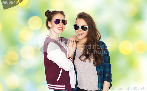Image of happy smiling pretty teenage girls in sunglasses