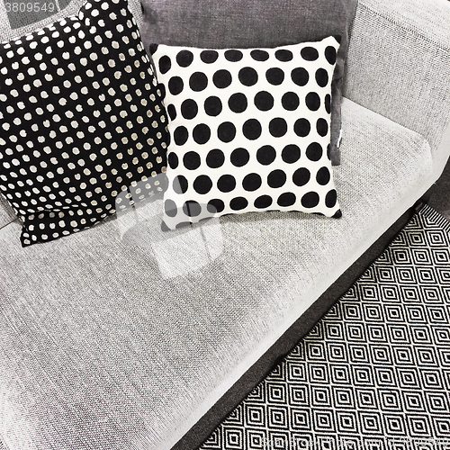 Image of Black and white polka dot cushions on a sofa
