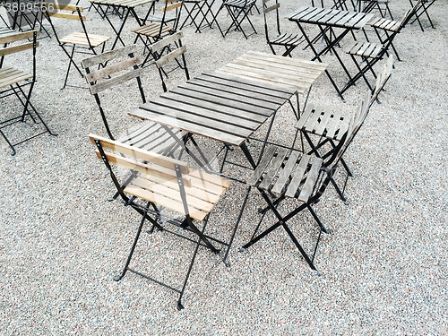 Image of Outdoor cafe with wooden tables