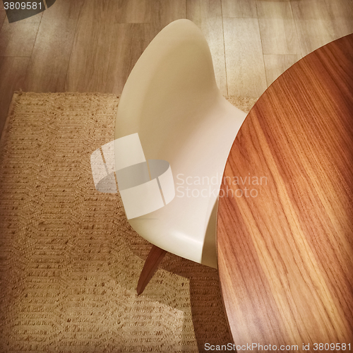 Image of Round table and white stylish chair