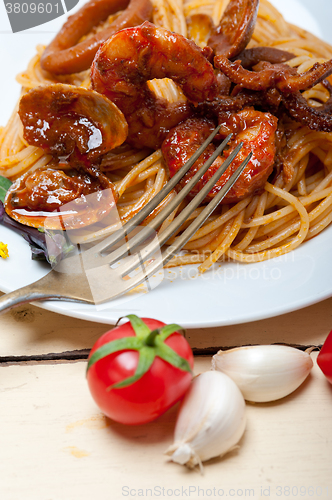 Image of Italian seafood spaghetti pasta on red tomato sauce 