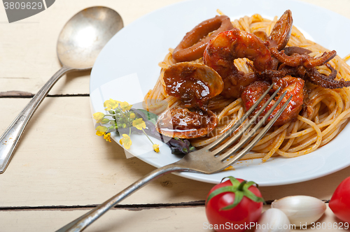 Image of Italian seafood spaghetti pasta on red tomato sauce 