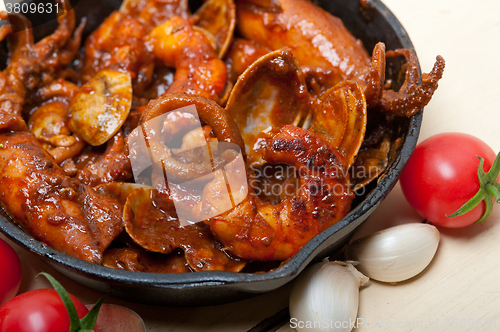 Image of fresh seafoos stew on an iron skillet