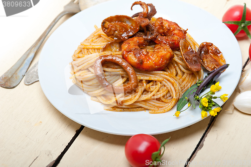 Image of Italian seafood spaghetti pasta on red tomato sauce 