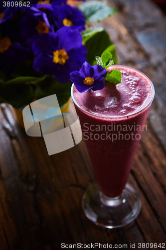 Image of Delicious berry smoothie on table