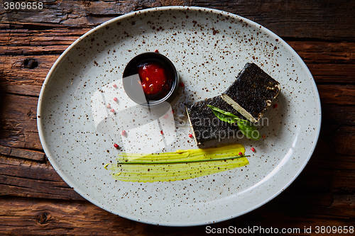 Image of Tofu fried in nori. Served with sauce