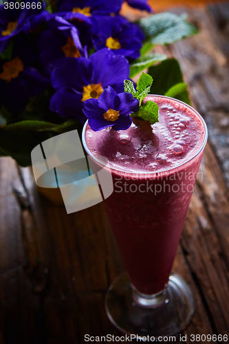 Image of Delicious berry smoothie on table