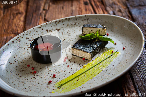 Image of Tofu fried in nori. Served with sauce