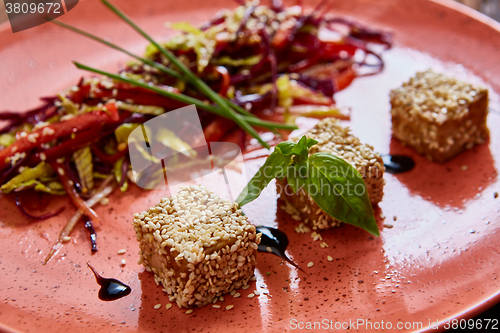 Image of Stir fried tofu in a bowl with sesame 