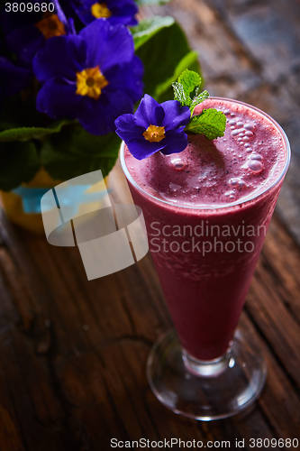 Image of Delicious berry smoothie on table