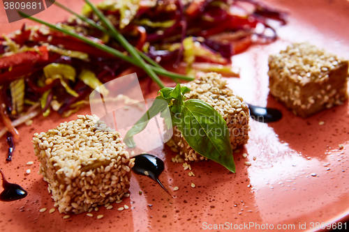 Image of Stir fried tofu in a bowl with sesame 