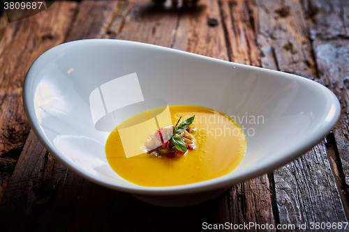 Image of Delicious cream soup made of lentil and vegetables on table