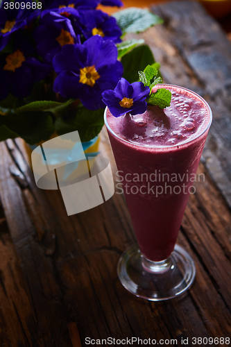 Image of Delicious berry smoothie on table