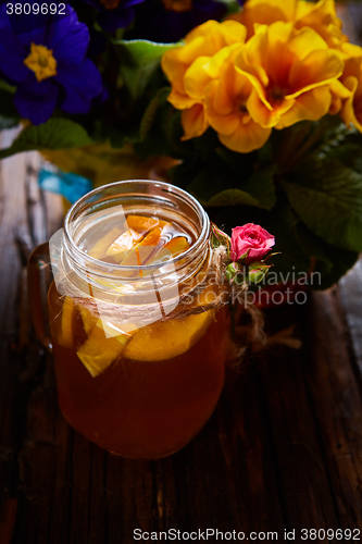 Image of Ginger tea with orange, spices and honey.