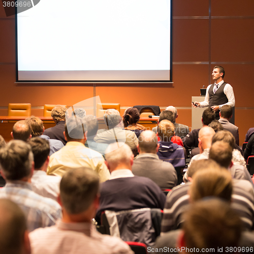 Image of Speaker at Business Conference and Presentation.